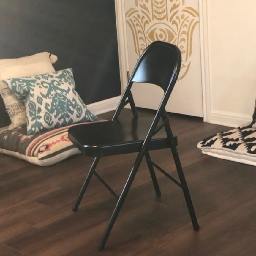 Study chair for chair yoga. We have a black metal folding chair with rubber grips on the feet.